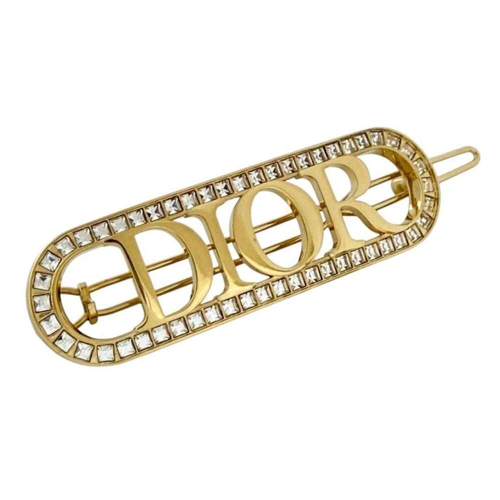 Christian Dior Dior women's hair clip/barrette/hairpin, Revolution, gold color.
